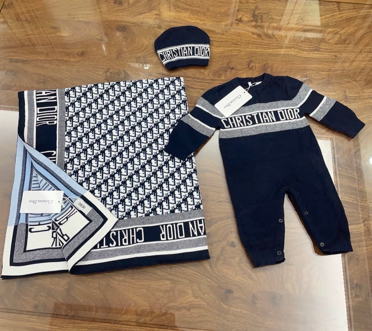 Black Dior romper and blanket