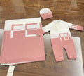 Pink romper and blanket