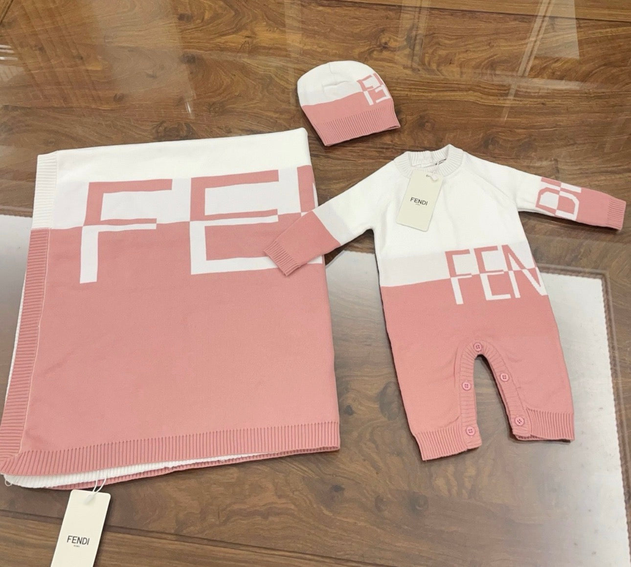 Pink romper and blanket